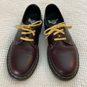 Practically brand new, brown low-top Dr Martens “with bouncing soles”.